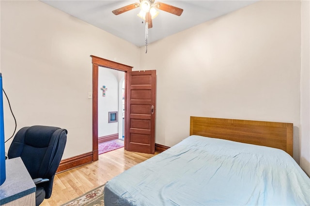 bedroom with ceiling fan and hardwood / wood-style floors