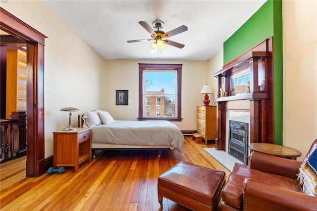 bedroom featuring ceiling fan and light hardwood / wood-style floors