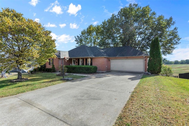 single story home with a garage and a front lawn