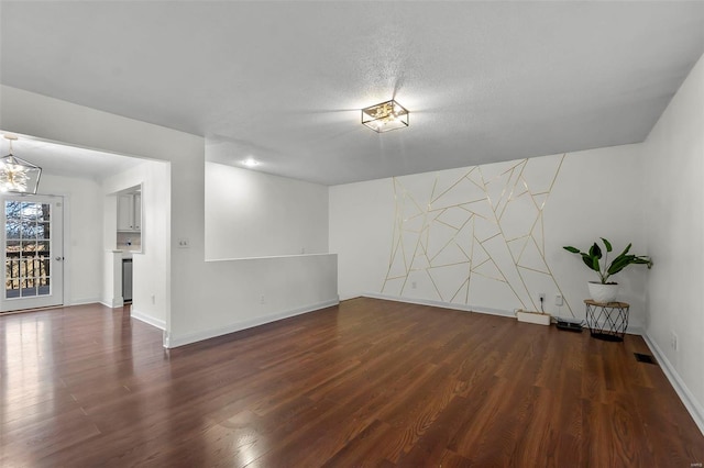 spare room featuring dark hardwood / wood-style floors