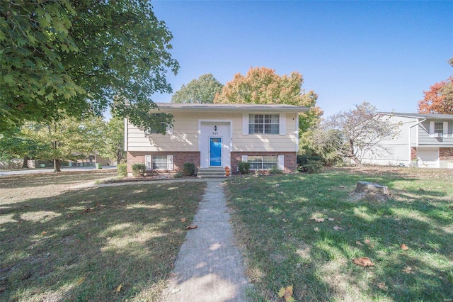 raised ranch featuring a front lawn