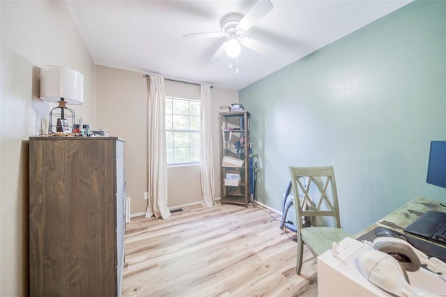 office area with light hardwood / wood-style flooring and ceiling fan