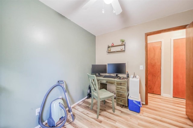 office area with light hardwood / wood-style floors, vaulted ceiling, and ceiling fan