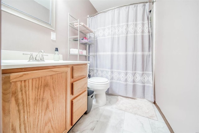 bathroom featuring vanity, toilet, and a shower with curtain