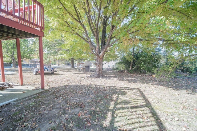 view of yard with a wooden deck