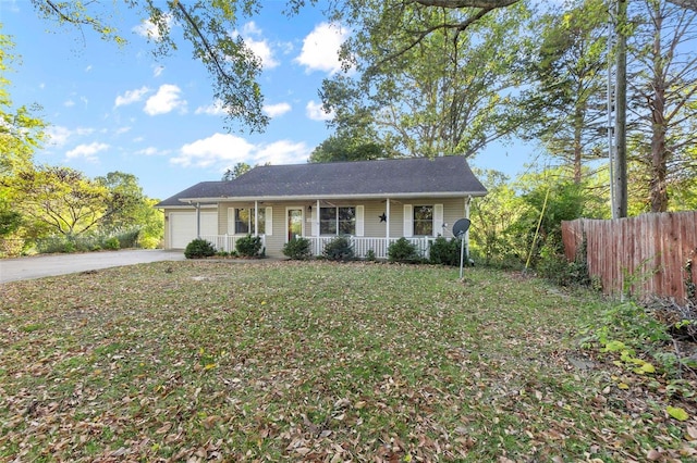 single story home featuring a porch, a front yard, and a garage