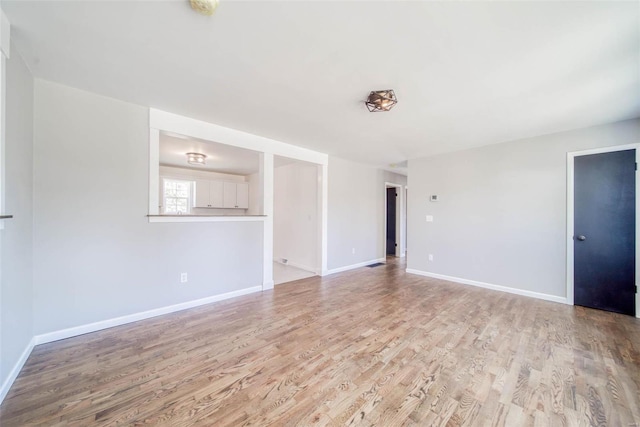 unfurnished living room with light wood-type flooring