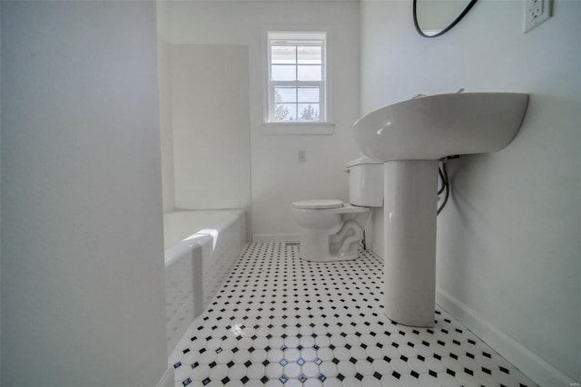 bathroom featuring tile patterned flooring and toilet