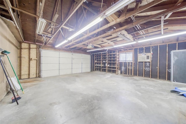 garage featuring a wall mounted AC