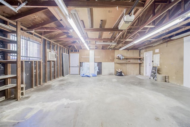 basement with a wall mounted air conditioner