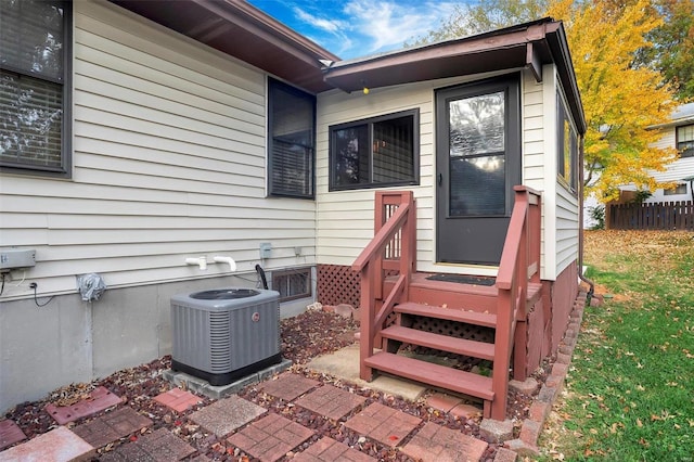 doorway to property featuring central AC