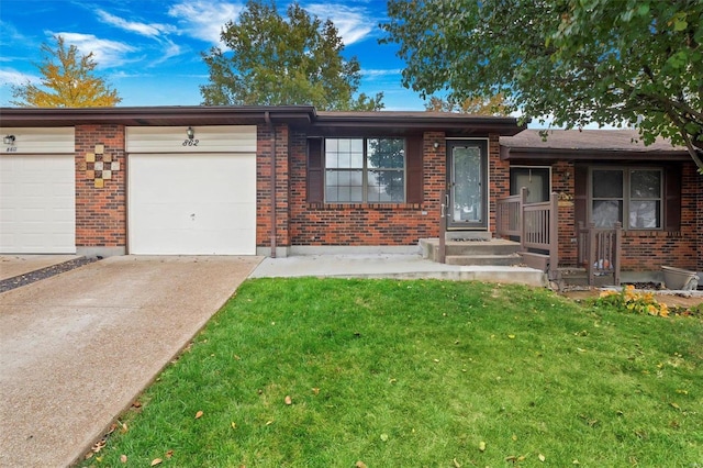 single story home featuring a front yard and a garage