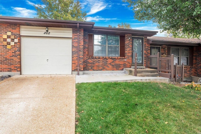 view of front facade with a garage and a front lawn