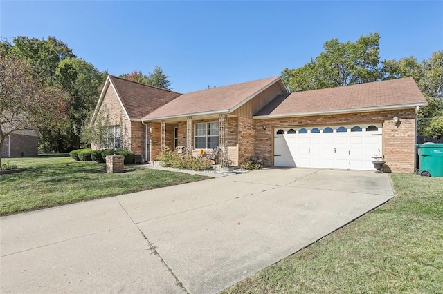 view of front of home with a front lawn and a garage