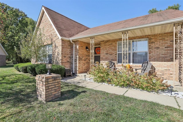 view of front of home with a front yard and a porch