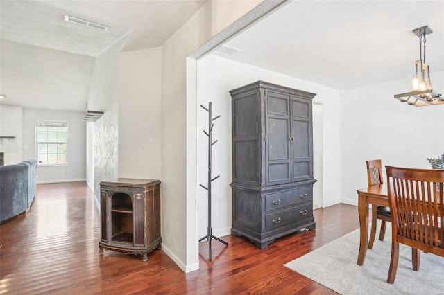 dining area with dark wood-type flooring