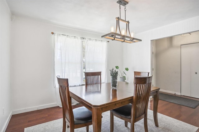 dining room featuring a chandelier and dark hardwood / wood-style flooring