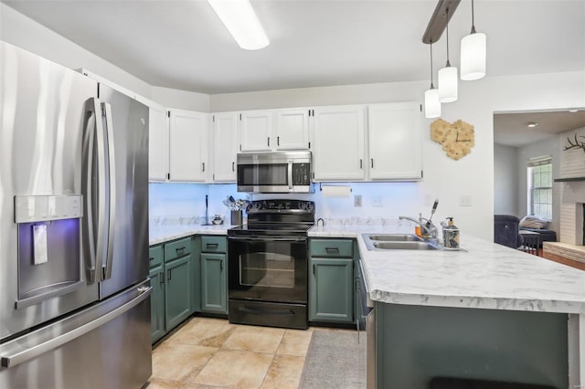 kitchen with appliances with stainless steel finishes, white cabinetry, sink, pendant lighting, and green cabinets