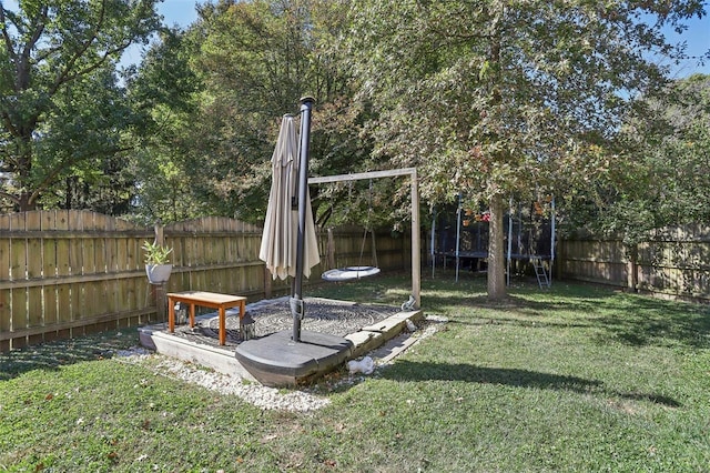 view of yard with a trampoline