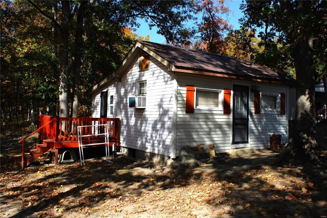 view of front of house featuring a wooden deck