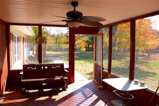 sunroom with ceiling fan and plenty of natural light