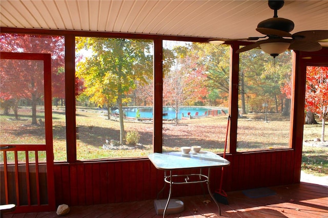 sunroom with ceiling fan and plenty of natural light