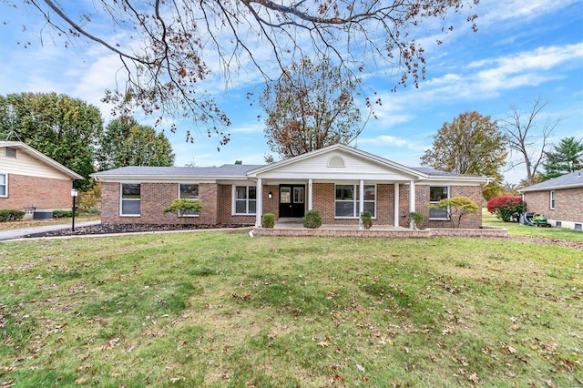 ranch-style home featuring a front yard