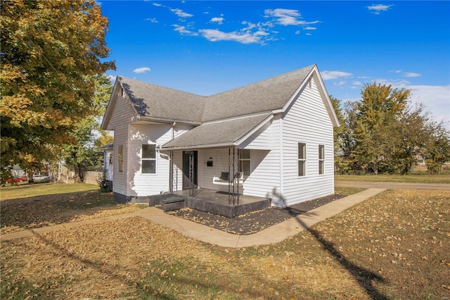 view of front of property with a front lawn and a patio