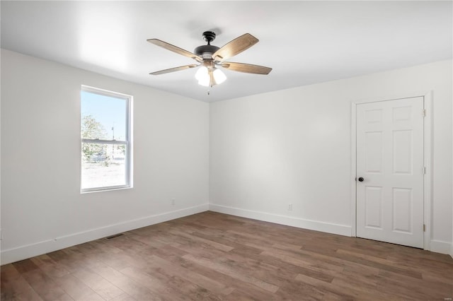 unfurnished room featuring ceiling fan and hardwood / wood-style flooring