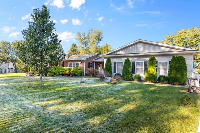 ranch-style home with a front lawn