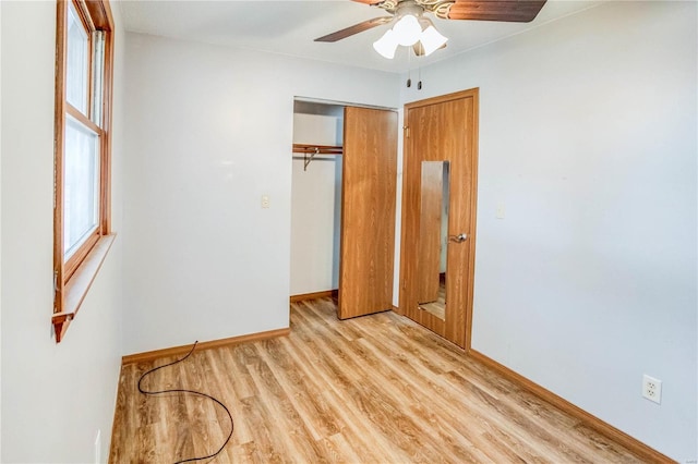 unfurnished bedroom with a closet, ceiling fan, and light wood-type flooring