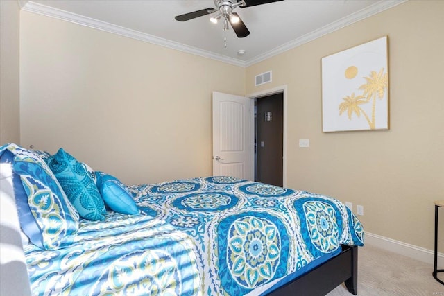 carpeted bedroom with ceiling fan and ornamental molding