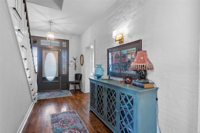 foyer entrance featuring dark wood-type flooring