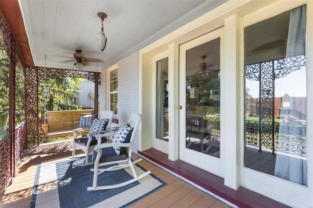 exterior space featuring ceiling fan