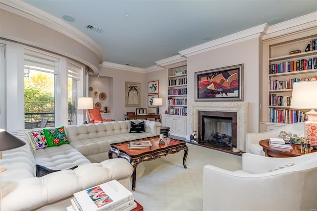 living room with crown molding and built in features