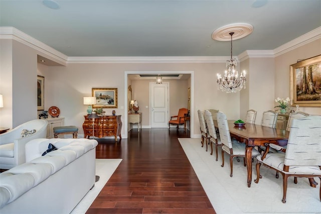 dining area with a notable chandelier, ornamental molding, and dark hardwood / wood-style floors