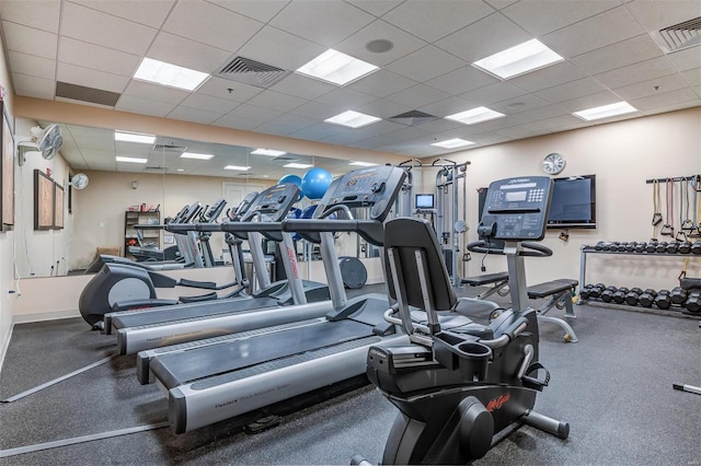 exercise room with a drop ceiling