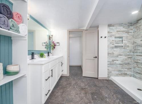 bathroom with vanity and walk in shower