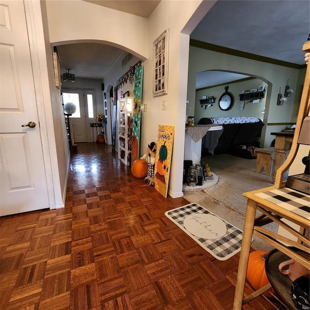 corridor with crown molding and dark parquet floors