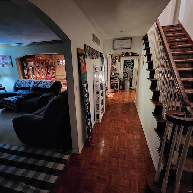 hall featuring dark parquet flooring