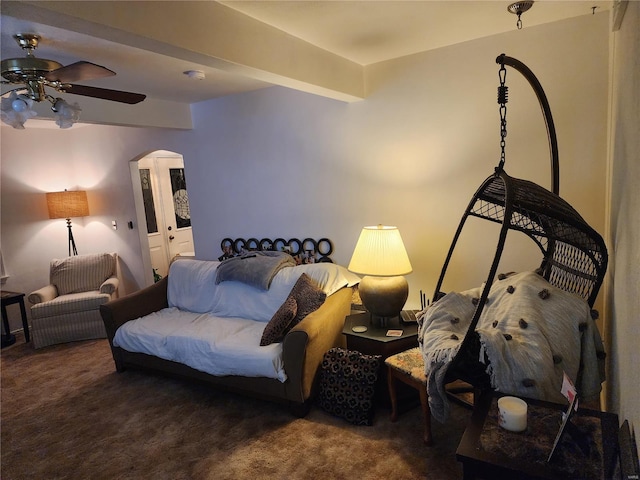 carpeted living room featuring beamed ceiling and ceiling fan