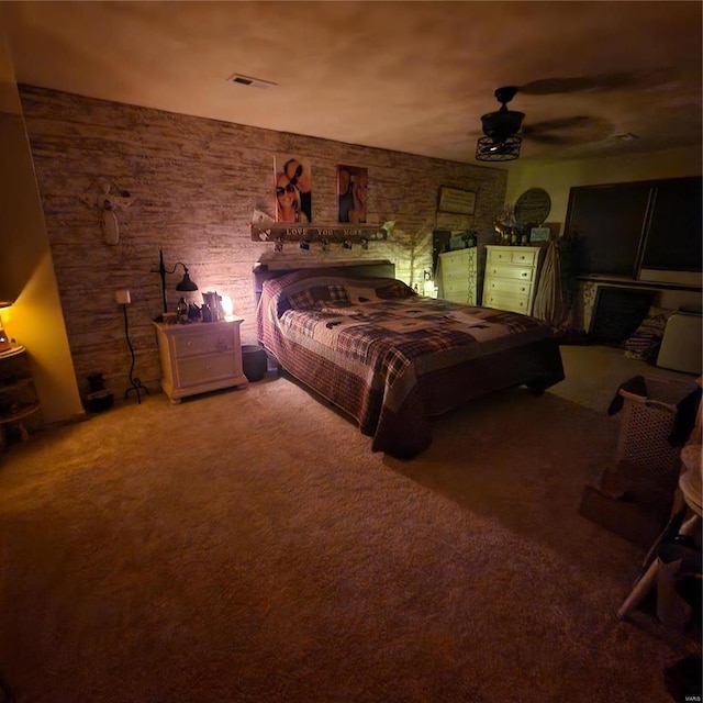 bedroom with ceiling fan and carpet floors