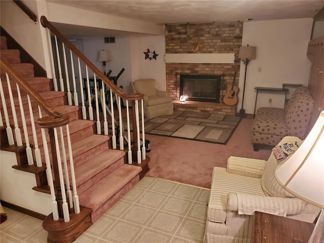 living room with carpet and a fireplace