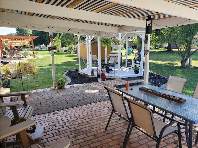 view of patio / terrace with a pergola and a storage shed