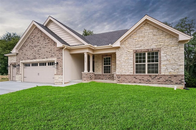 craftsman-style home featuring a front yard and a garage