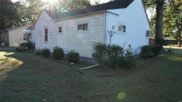 view of property exterior with a lawn