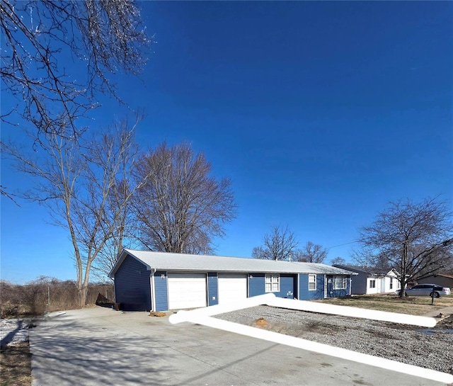 view of front of home with an attached garage and driveway