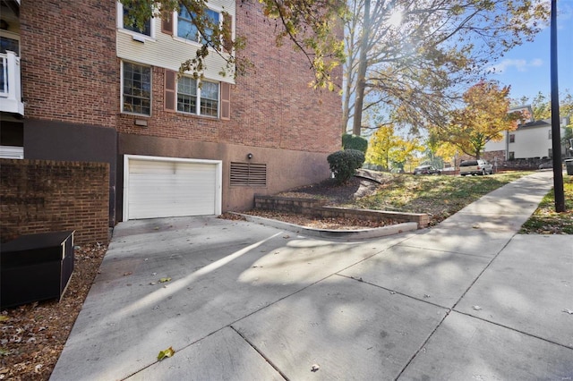 view of side of property featuring a garage