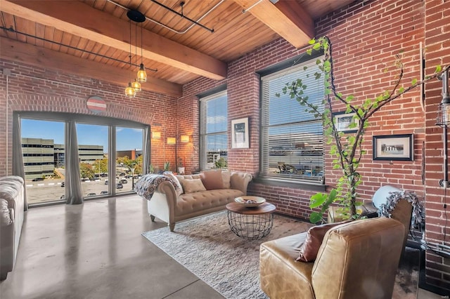 living room with wood ceiling, brick wall, beam ceiling, and concrete floors