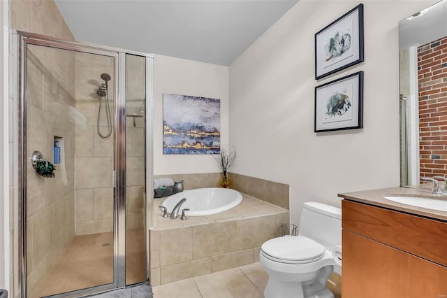 full bathroom with vanity, toilet, tile patterned floors, and independent shower and bath